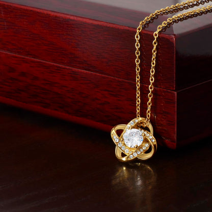 Dazzling Affection: Valentine's Love Knot Necklace in 18K Yellow Gold with CZ Stone